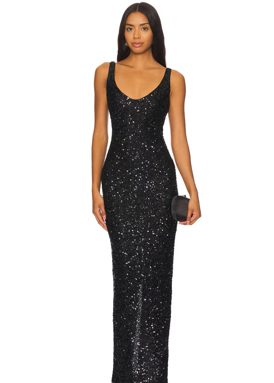 Woman wearing a black sequin gown on a white background